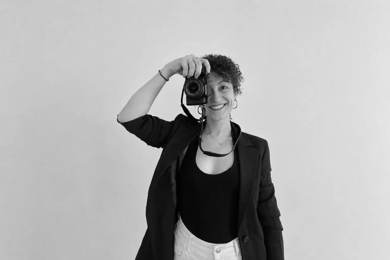 Portrait photographer holding a camera