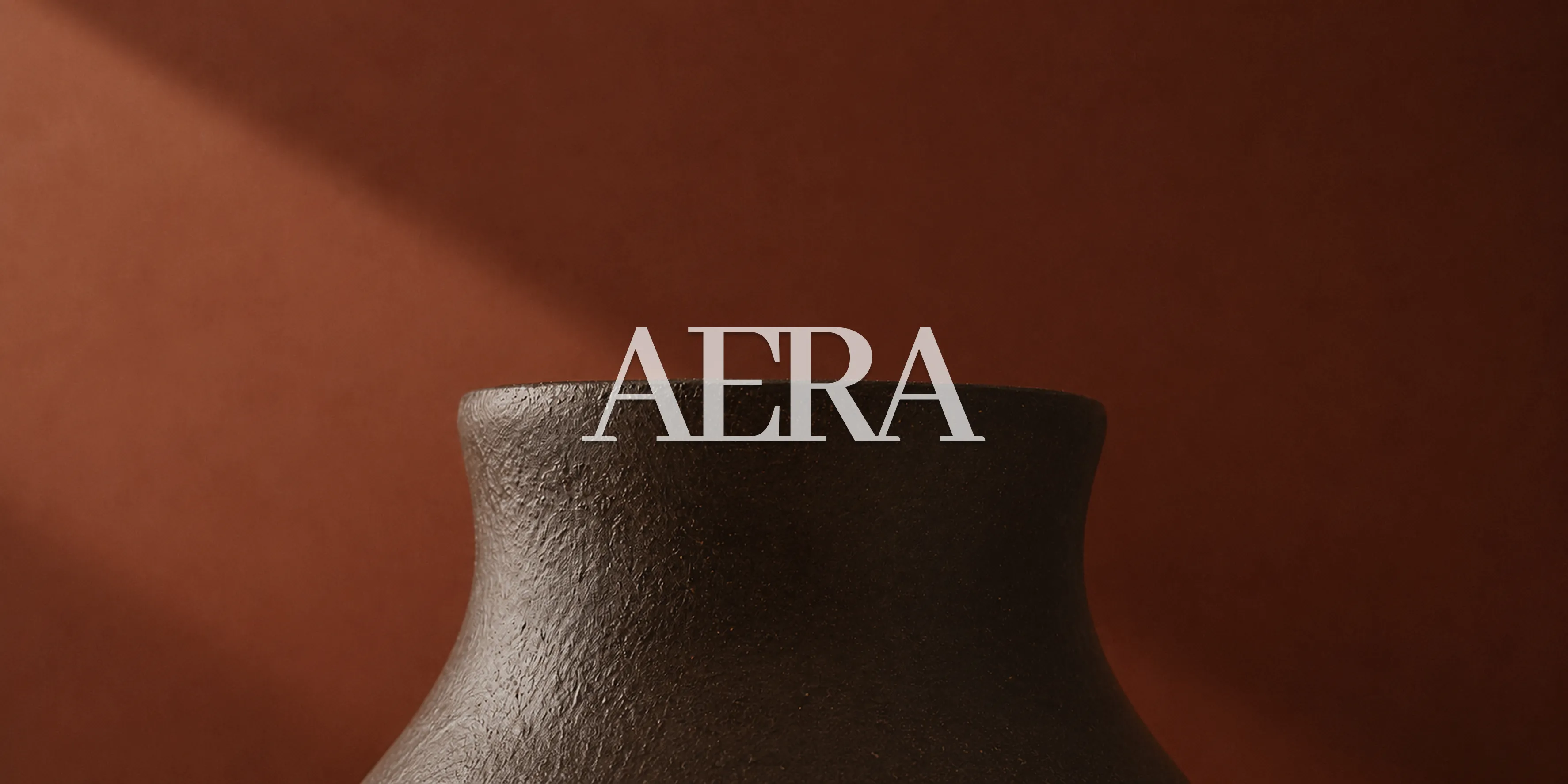 Editorial branding artwork on a ceramic vase